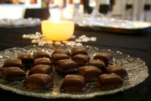 Individual chocolates laid on a glass plate