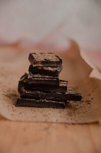 stacked chocolate pieces on brown paper